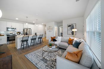 Spacious Living Area With Wood-Style Flooring